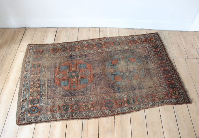 Faded vintage rug